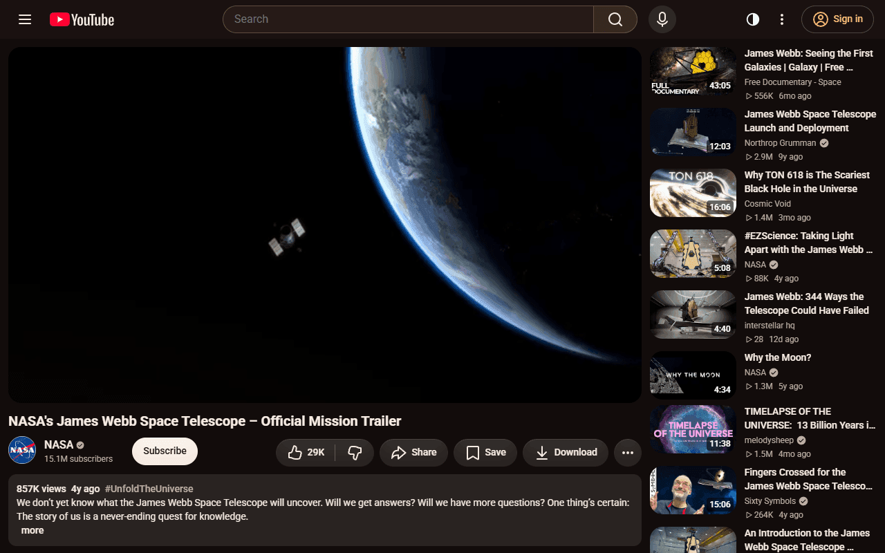 A YouTube watch page in the Cinema theme: warm espresso tones and a wide player with a narrow list beside it.